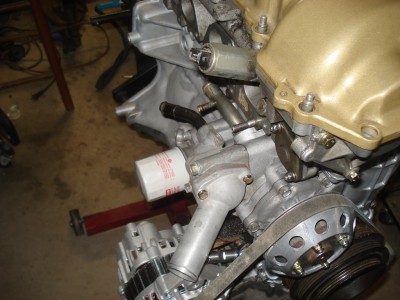 Intake side.  Water inlet and oil filter boss.
